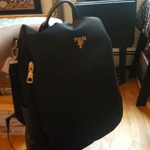 POABA medium sized, black w/gold back pack, purse